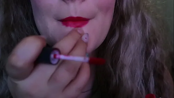 CUTE WOMAN PAINTS HER LIPS RED AND SMOKES a CIGARETTE, I HOPE YOU LIKE IT Video ấm áp lớn